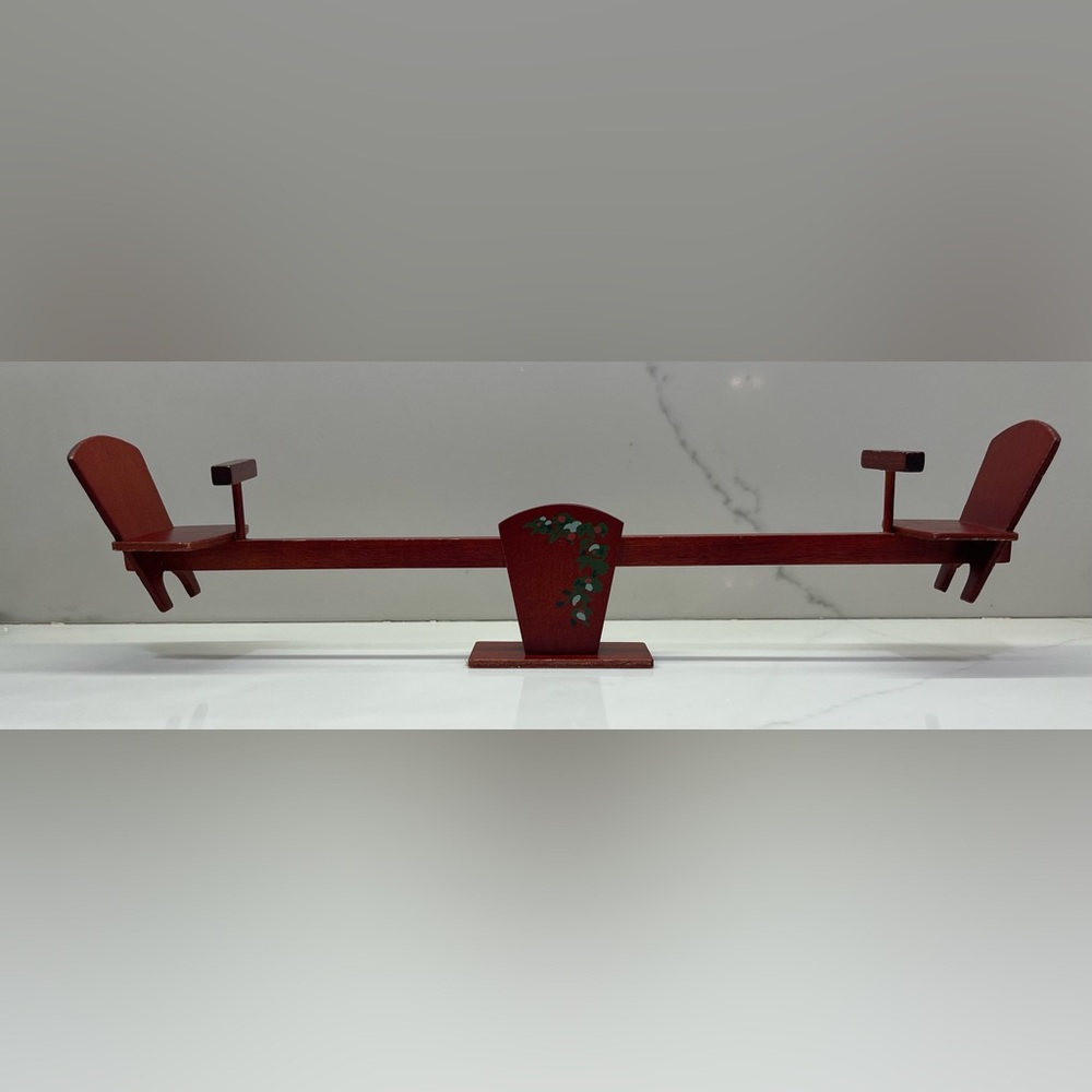 miniature wooden seesaw designed for a dollhouse
